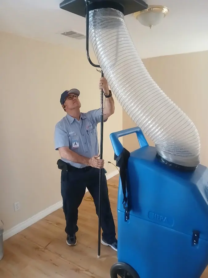 Furnace Tune-Up technician using HEPA equipment in North Sewickley